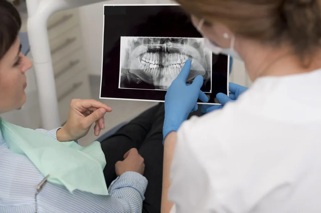 Family Dental Care provides exceptional periodontal care as a dentist explains a patient's x-rays.